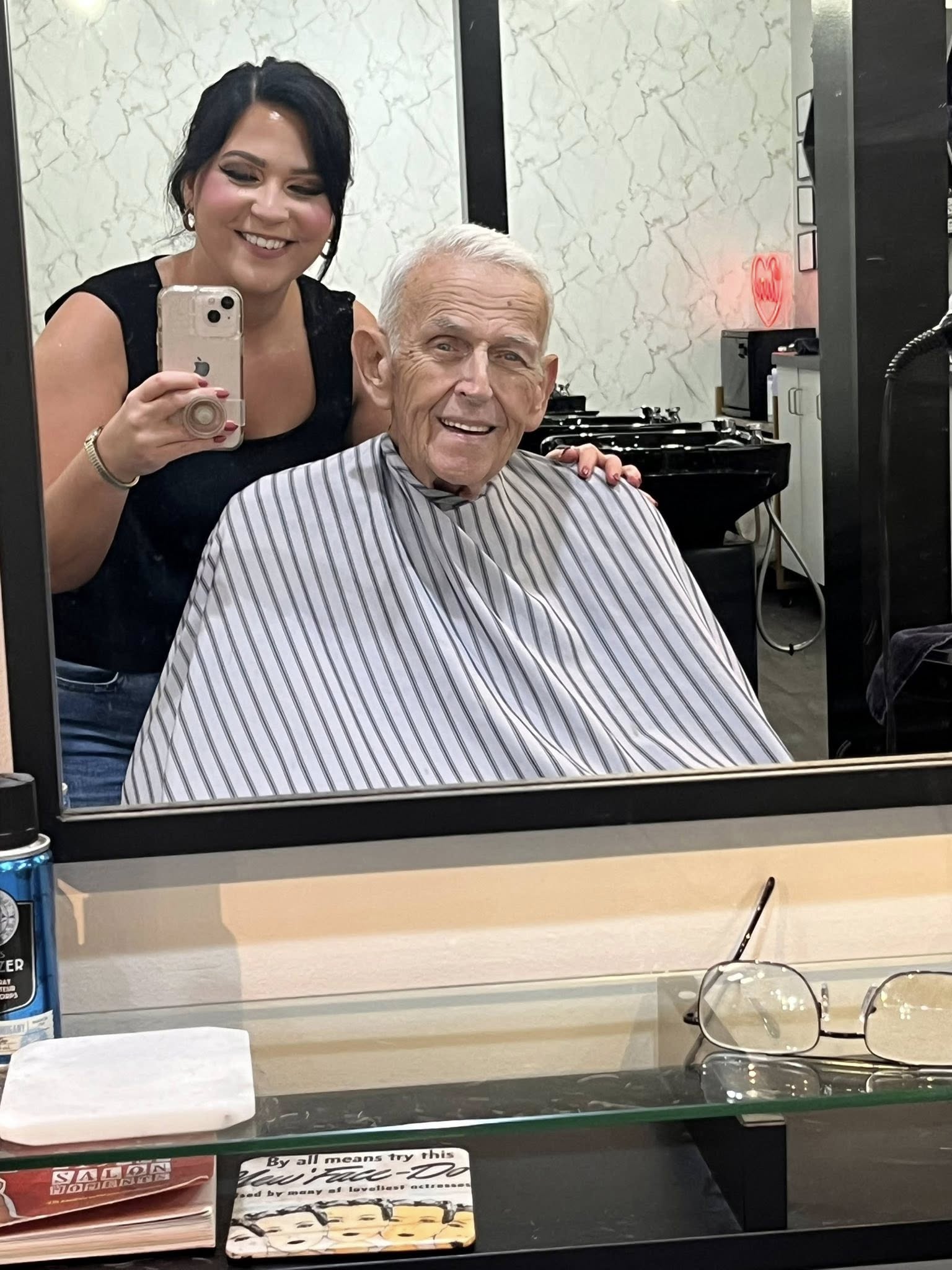 Stylist working with a client at Adore Beauty