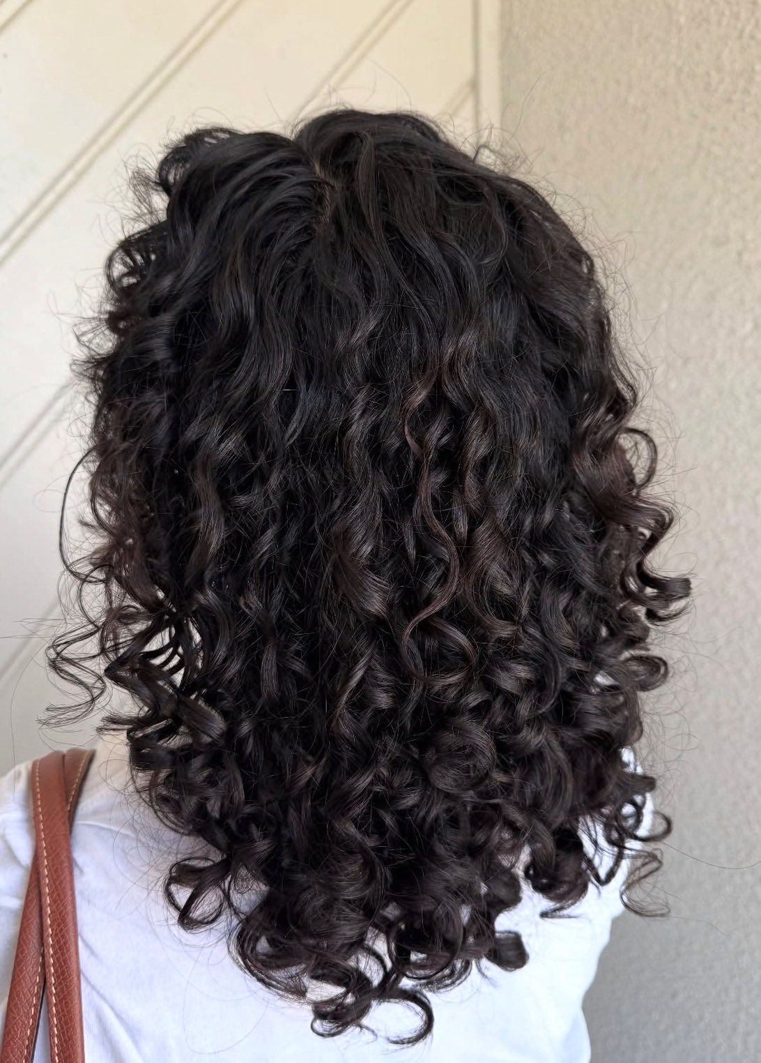 Dark curly hair styling